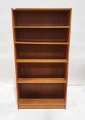 Three teak-effect open bookcases on plinth bases (3)