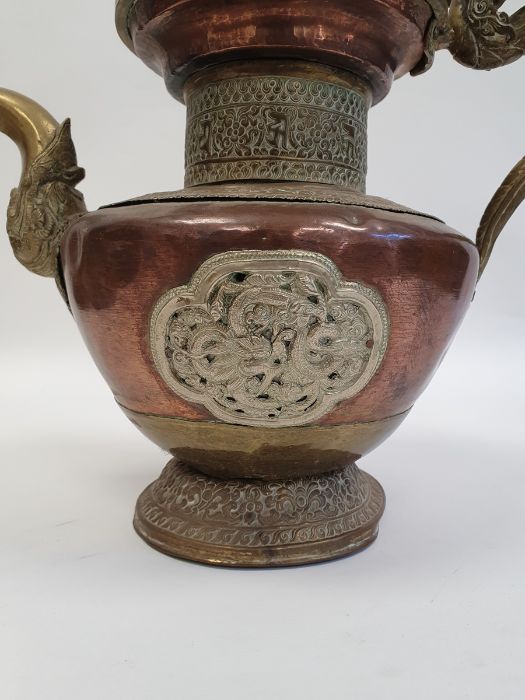 Late 19th century or later, Tibetan copper and brass fitted teapot, with Naga form handle. - Image 19 of 33