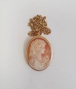 Gold-coloured carved shell cameo pendant/brooch, marks indistinct and the 9ct gold chain link