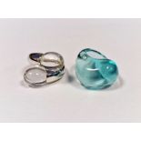 Baccarat silver and clear glass crossover ring, cased and a Baccarat turquoise glass ring, cased (2)