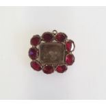Victorian gold-coloured metal and almandine garnet mourning hair brooch, the rectangular central