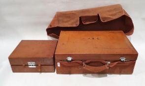 One large brown leather suitcase initialled 'J.C.E' with accompanying dust jacket (36cm x 56cm x