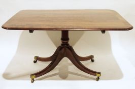 Regency mahogany tilt-top table, the rectangular crossbanded top with rounded corners, to single