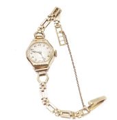 Lady's 9ct gold vintage wristwatch with circular dial, Roman numerals, in octagonal case and the 9ct