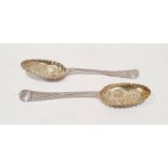 Two George II silver berry spoons, cut and embossed decoration and one further similar, London 1759,