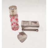 Silver postage stamp holder with two glass inset panels to the hinged lid, on a barrel-shaped