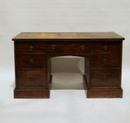 19th century kneehole mahogany desk with brown leather inset top, assorted drawers, to plinth