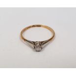18ct gold small solitaire diamond ring, the claw set stone with platinum shoulders, in small vintage
