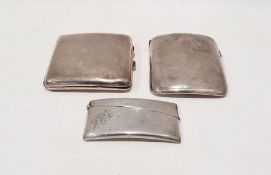 Two silver cigarette cases with gilt washed interiors and a silver card case, 7.1ozt (3)