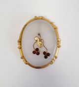 Agate, gold-coloured metal and garnet brooch, oval with floral spray