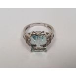 14K gold, aquamarine and diamond ring set central rectangular cut pastel blue aquamarine, approx.