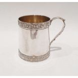 Georgian silver mug with grape and vine band decoration to the rim, acanthus handle, crested body,