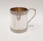 Georgian silver mug with grape and vine band decoration to the rim, acanthus handle, crested body,
