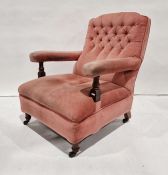 Late 19th century armchair with pink upholstered seat, back and armrests, on turned front legs to