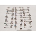 Thirty seven assorted silver souvenir teaspoons including examples with enamel finials bearing the