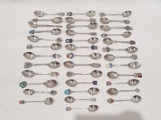Thirty seven assorted silver souvenir teaspoons including examples with enamel finials bearing the