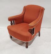 Early 20th century mahogany framed armchair with pink ground upholstery, on turned front legs