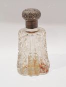 Silver and glass scent bottle, the silver hinged embossed lid on cut glass body