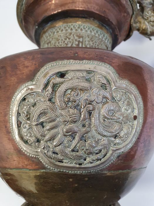 Late 19th century or later, Tibetan copper and brass fitted teapot, with Naga form handle. - Image 32 of 33