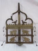 20th century metal wall bird feeder decorated with elephants, birds and horse silhouettes. 57 x