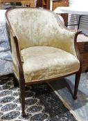 Early 20th century upholstered chair, tapering front legs to black feet. Floarl cream upholstery