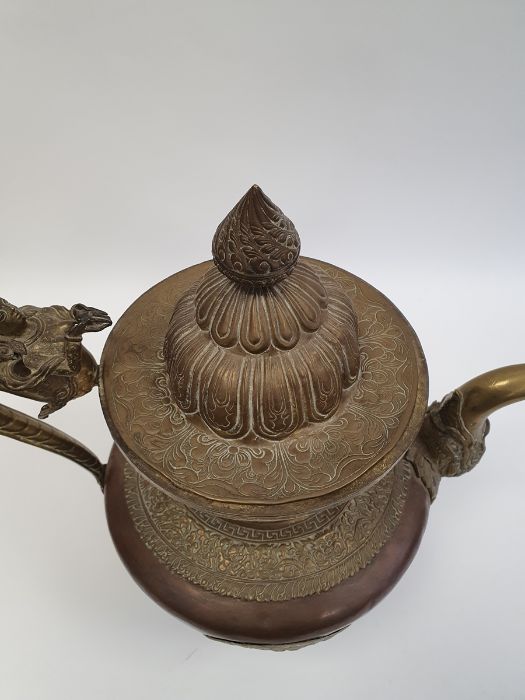 Late 19th century or later, Tibetan copper and brass fitted teapot, with Naga form handle. - Image 3 of 33