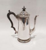 Late Victorian silver coffee pot with ebony finial and handle, on circular foot, Goldsmiths &