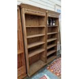 Pair of 20th century pine open bookcases with applied moulded cornices, on plinth bases (2)