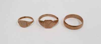 9ct gold signet ring, a 9ct gold wedding ring and a gold-coloured ring indistinctly marked (cut),
