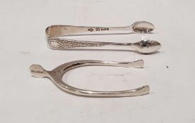 Pair silver wishbone sugar nips and a pair silver sugar nips with chased decoration (2)