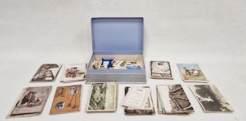 Box of vintage postcards of historical and humorous subjects and a quantity of cigarette cards