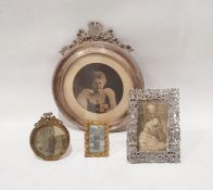 Circular silver photograph frame and three further photograph frames (4)