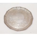 Edward VII silver salver of lobed circular form, engraved scrolling and shell decoration, central