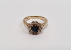 9ct gold, sapphire and white stone cluster ring, having centre facet-cut sapphire with surround of