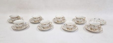 Set of eight Meissen coffee cups and saucers, each with scalloped everted rim, painted with pansy,