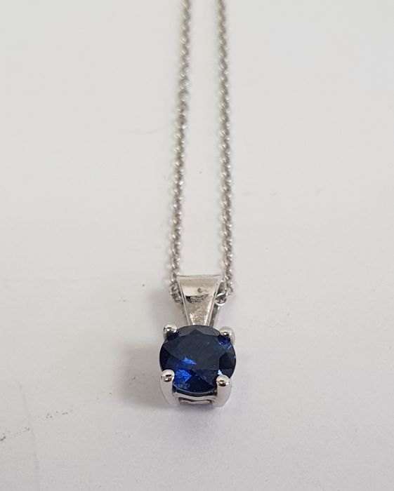 18K white gold and sapphire pendant set single circular stone and the 18K white gold fine chain link - Image 2 of 3