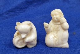 Two figures, one inuit woman seated and with listening expression, the other a bear crouched over