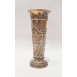 Late Victorian silver vase with embossed scrolling foliate decoration, of tapered form, London
