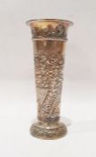 Late Victorian silver vase with embossed scrolling foliate decoration, of tapered form, London