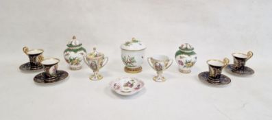 Four Vienna china coffee cans and saucers, figure decorated in reserves to royal blue and gilt