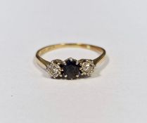 9ct gold, sapphire and diamond ring set oval sapphire flanked by two illusion set diamonds