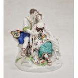 19th century Meissen porcelain figure group of shepherd and shepherdess seated on rocky mound, the