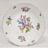 Meissen porcelain charger decorated with naturalistic floral sprays, roses, relief scroll and