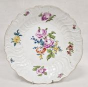 Meissen porcelain charger decorated with naturalistic floral sprays, roses, relief scroll and