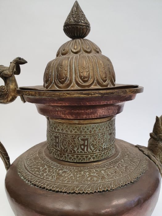 Late 19th century or later, Tibetan copper and brass fitted teapot, with Naga form handle. - Image 4 of 33