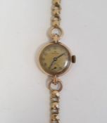 Lady's 9ct gold Rolex wristwatch having Arabic numerals, subsidiary seconds dial and side button and