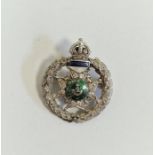 White metal, diamond and enamel regimental brooch, “Rajputana Rifles, Bourbon”, the wreath border