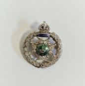 White metal, diamond and enamel regimental brooch, “Rajputana Rifles, Bourbon”, the wreath border