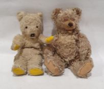 Two mid-20th century golden/blonde straw stuffed teddy bears with felt pads  (One with plastic