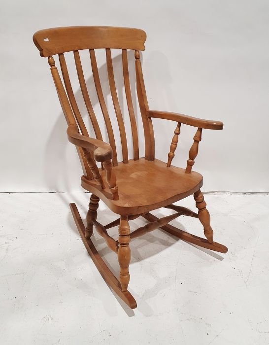 20th century beech slatback rocking chair on turned front legs to the rockers